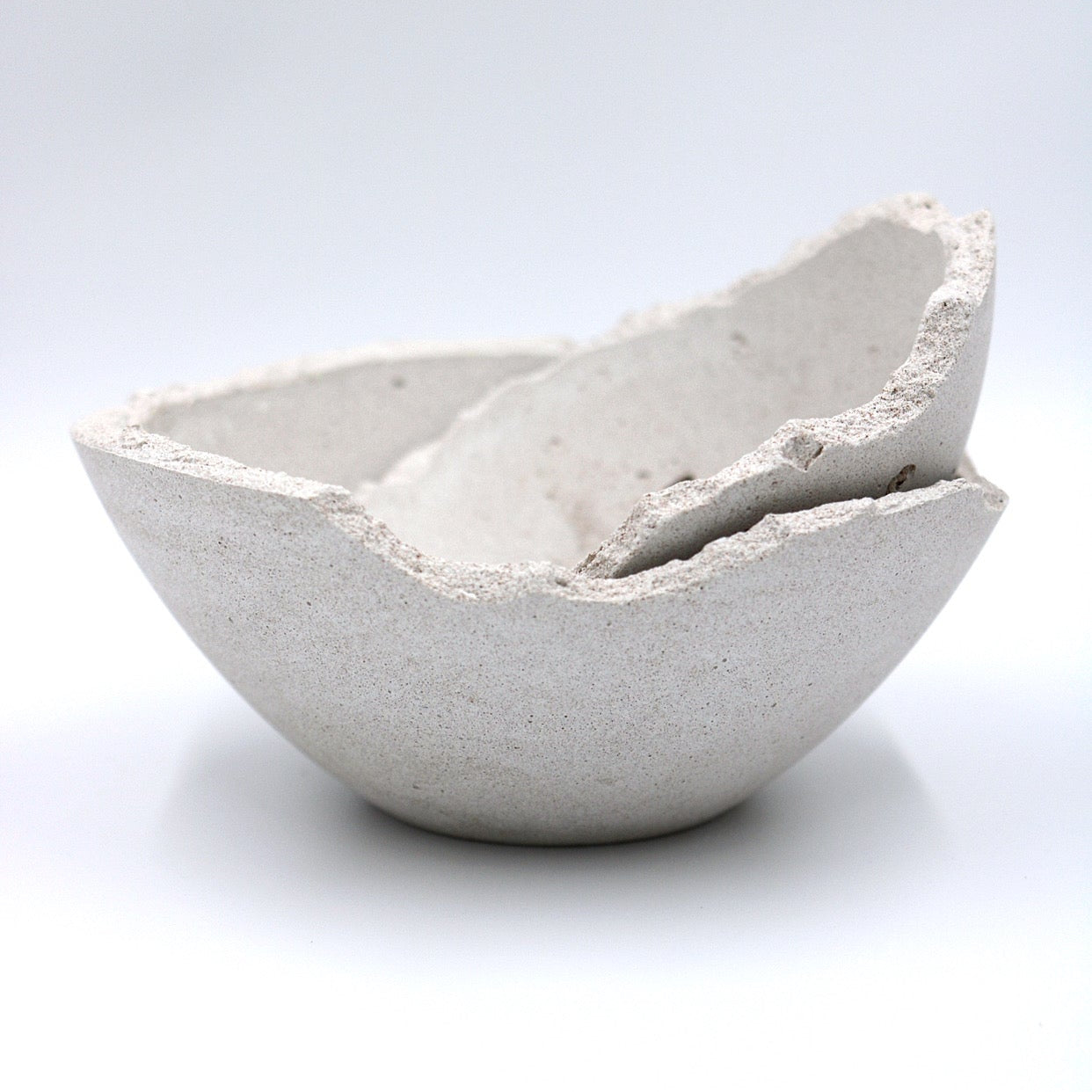 pluto. hand-poured soy wax candles in concrete bowls
