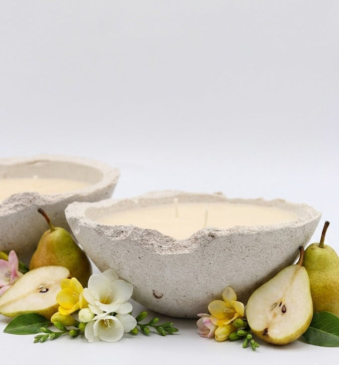 Ceramic bowl with pears and flowers on a white background