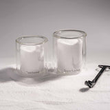 Wick trimmer, sand-textured soy wax candle by pluto. Dubai