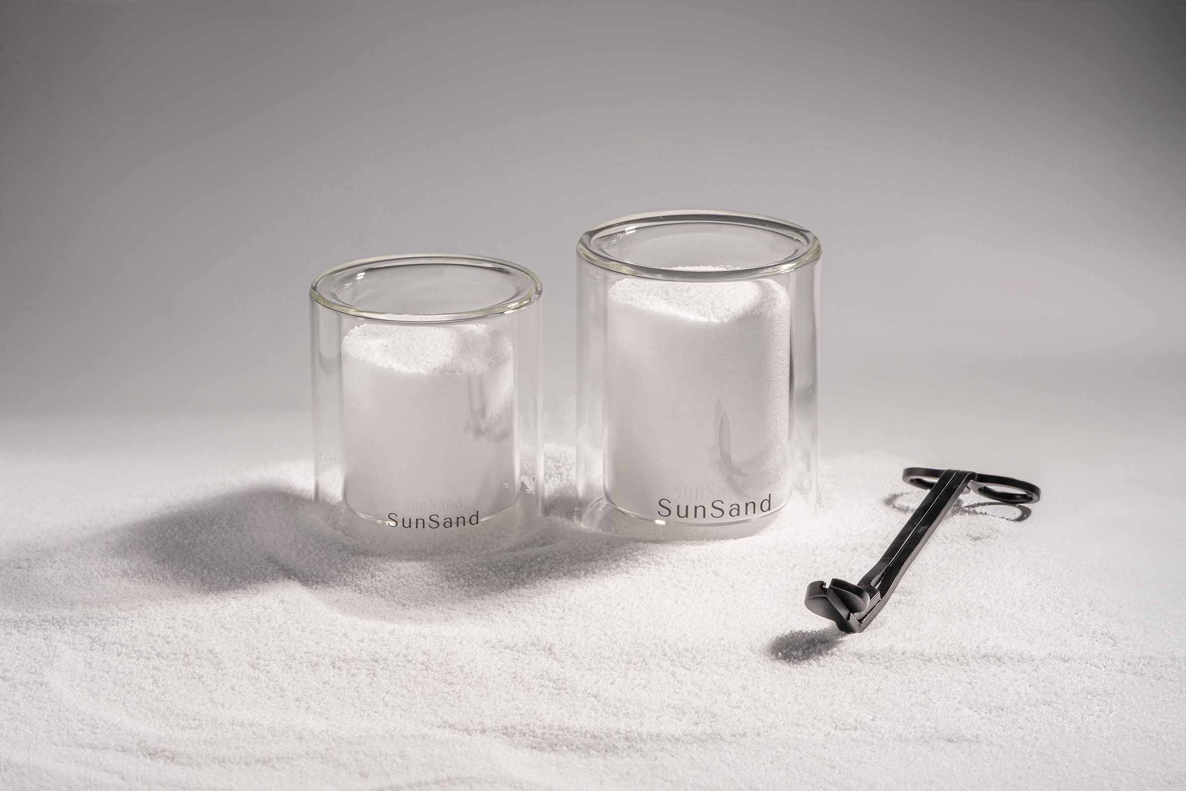 Wick trimmer, sand-textured soy wax candle by pluto. Dubai