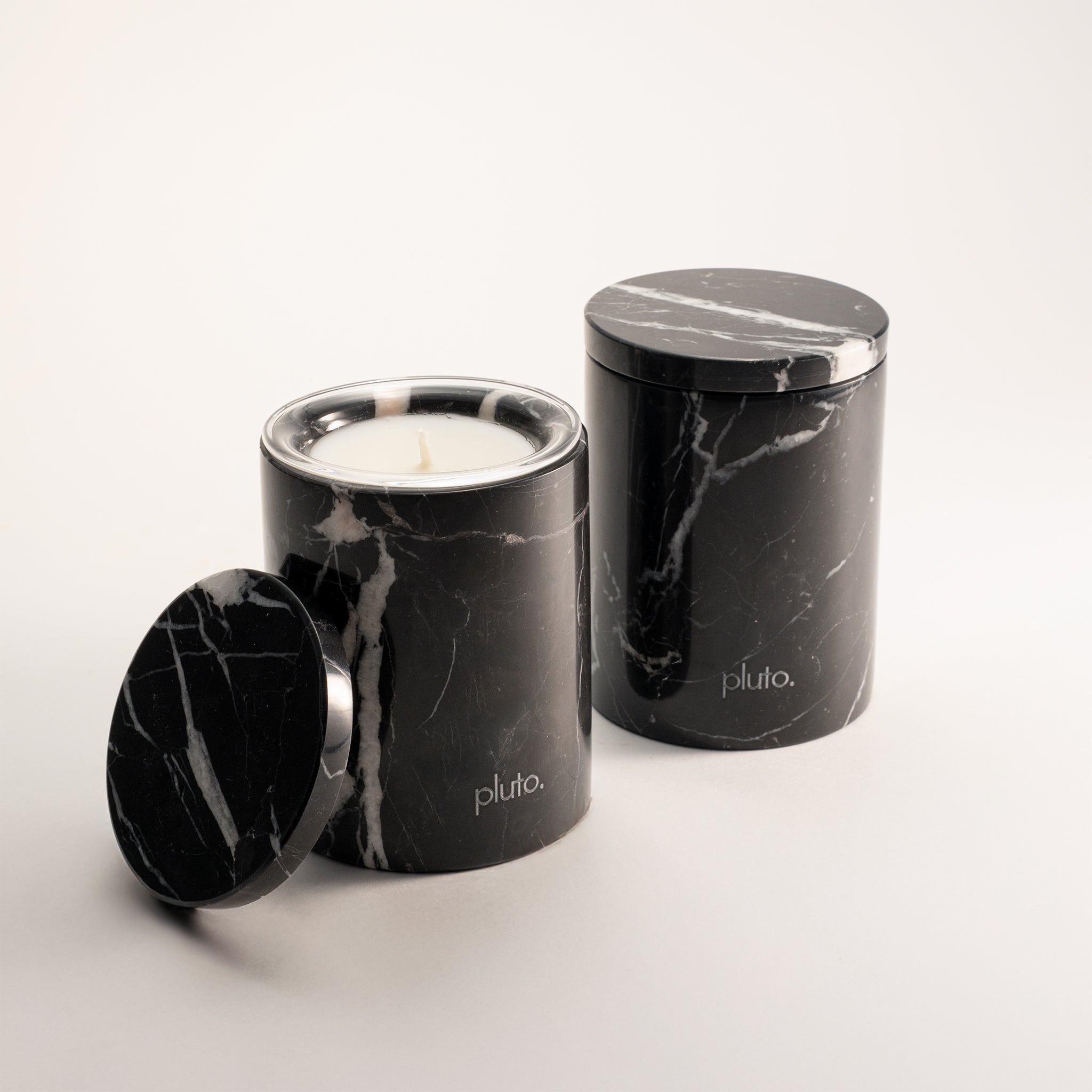 Black Marquina marble candle vessel close-up, refillable soy wax candle, pluto. Dubai