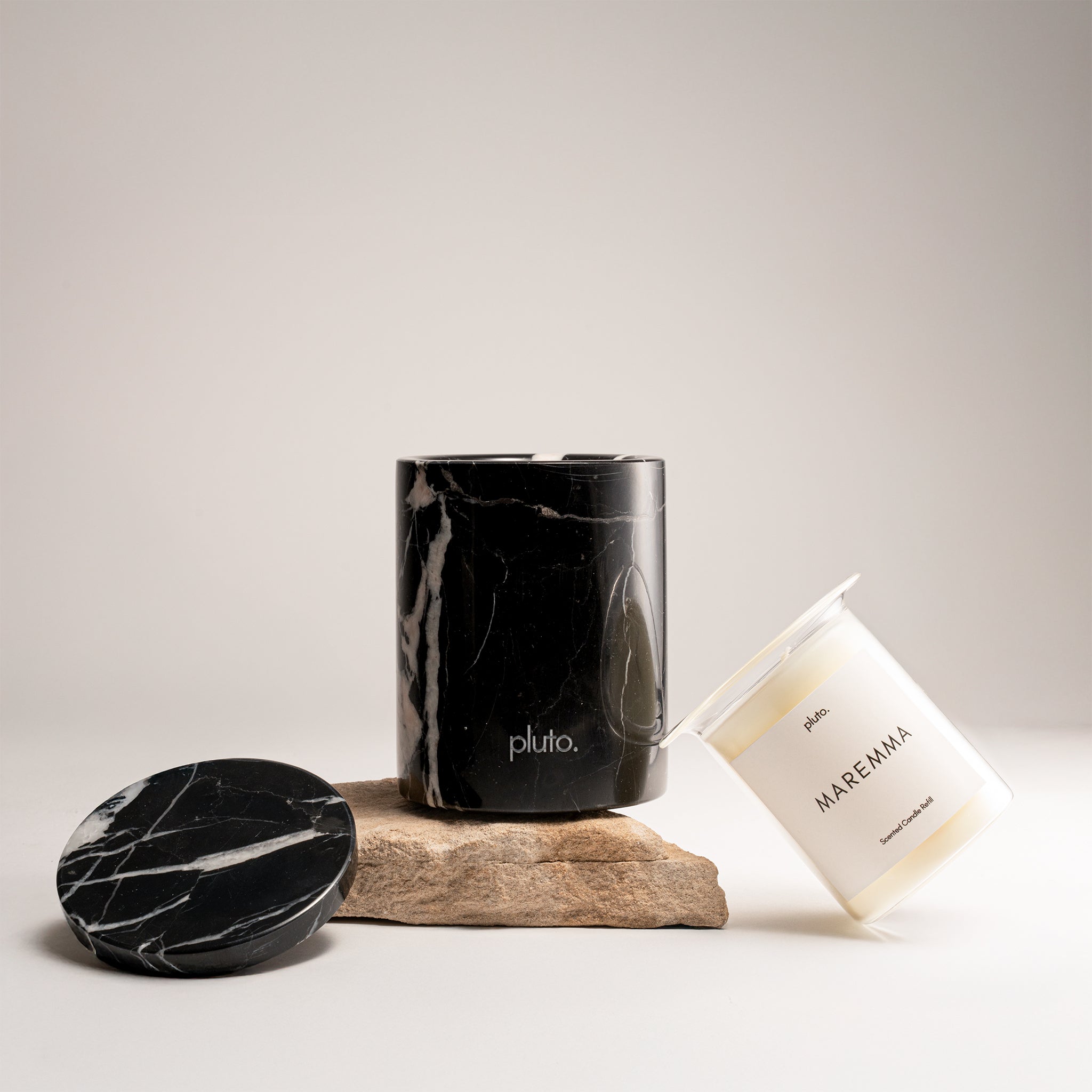 Black Marquina Marble Candle Set by pluto., hand-poured soy wax candle in natural Black Marquina marble vessel, Dubai