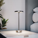 Silver cordless table lamp in a bedroom