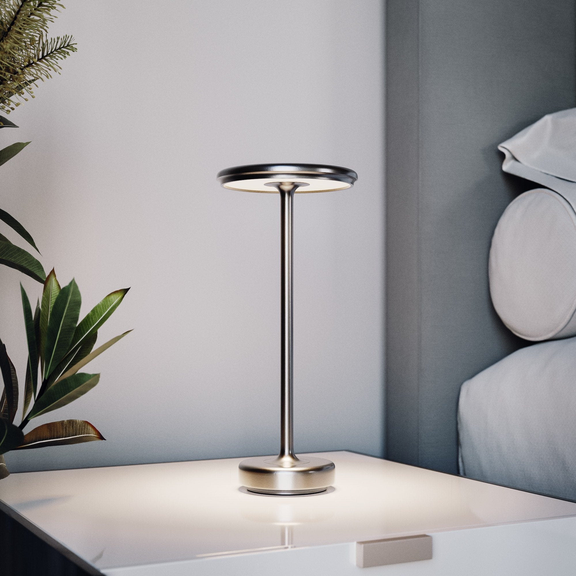 Silver cordless table lamp in a bedroom
