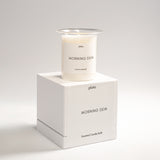 Morning Dew candle with fresh, clean, and crisp notes evoking the gentle scent of early morning dew on grass and flowers
