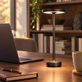 Black cordless lamp on a walnut work desk