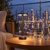 Black cordless lamp on a Dubai balcony at blue hour