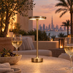 Gold cordless lamp on a Dubai villa terrace at dusk