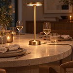 Gold XL table lamp on a travertine dining table