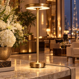 Gold XL table lamp on a hotel lobby console