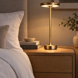 Gold XL table lamp on an oak bedside chest